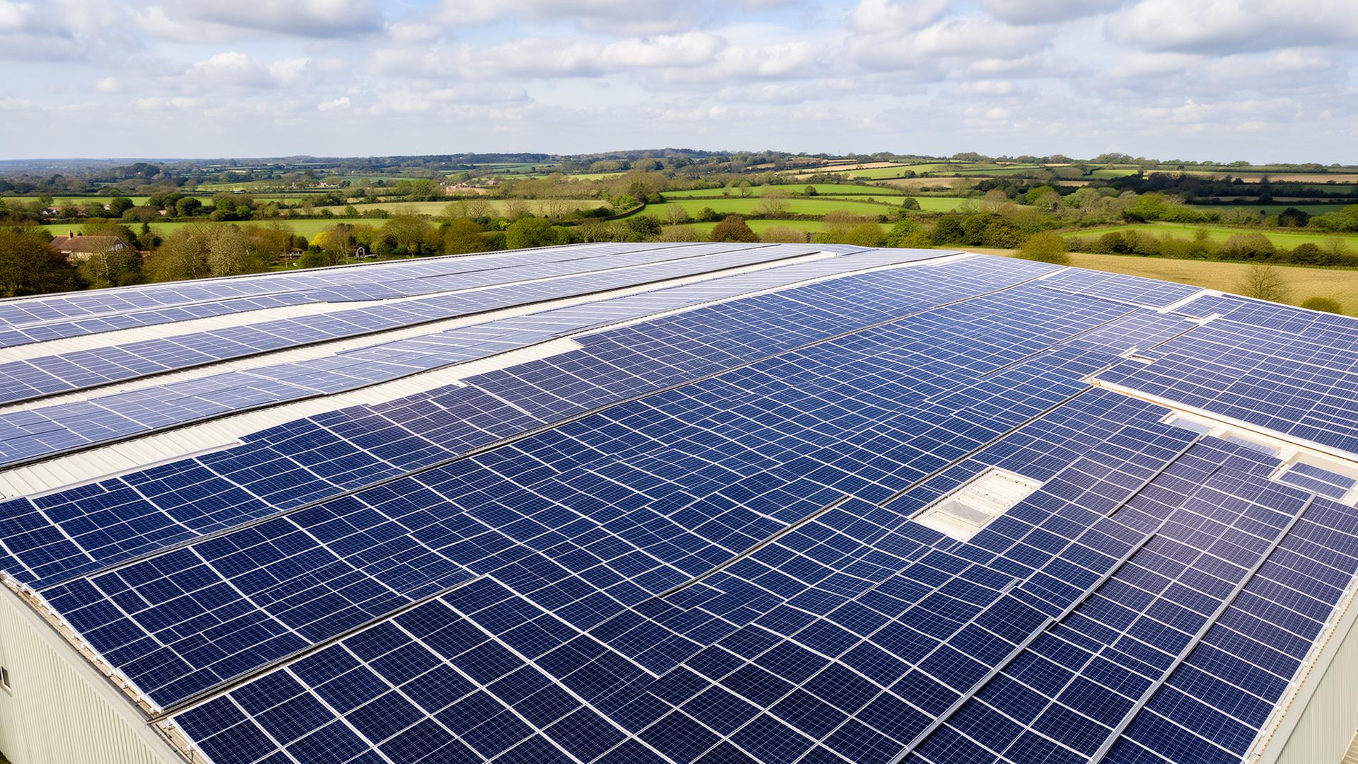 Aerial view of commercial rooftop solar array